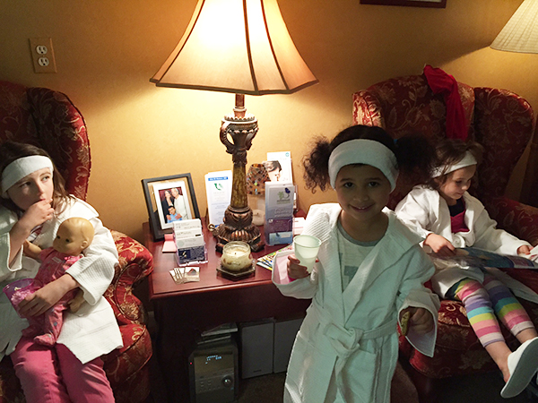 Children dressed in spa robes at a party