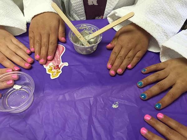 Children having their nails painted